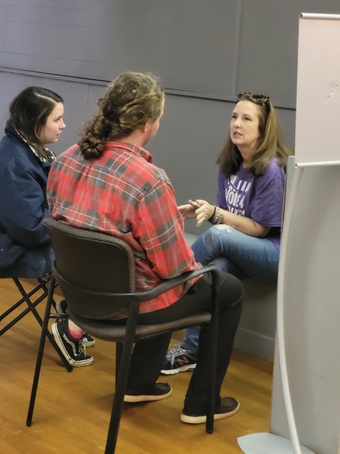 Woman sitting on chair in hair salon